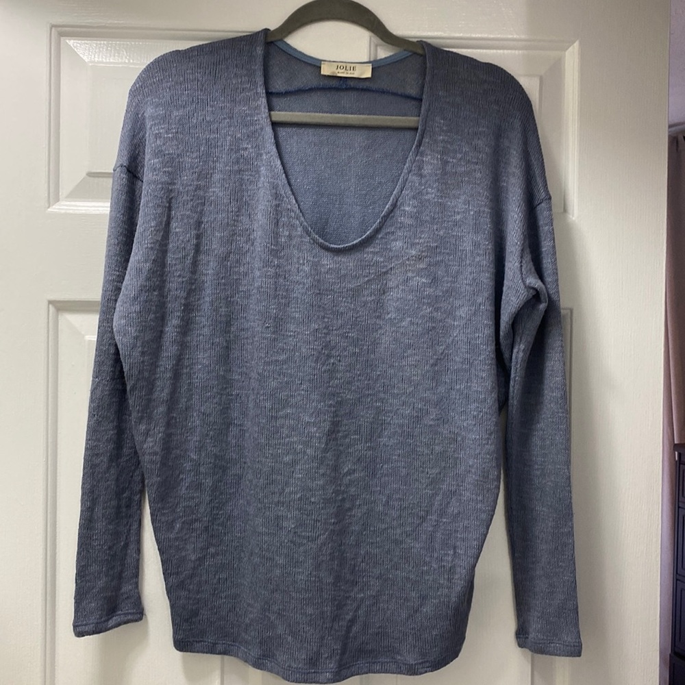 Light blue brand new light sweater that has never been worn